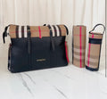 Black and chequered changing bag