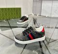 Black and red striped shoes