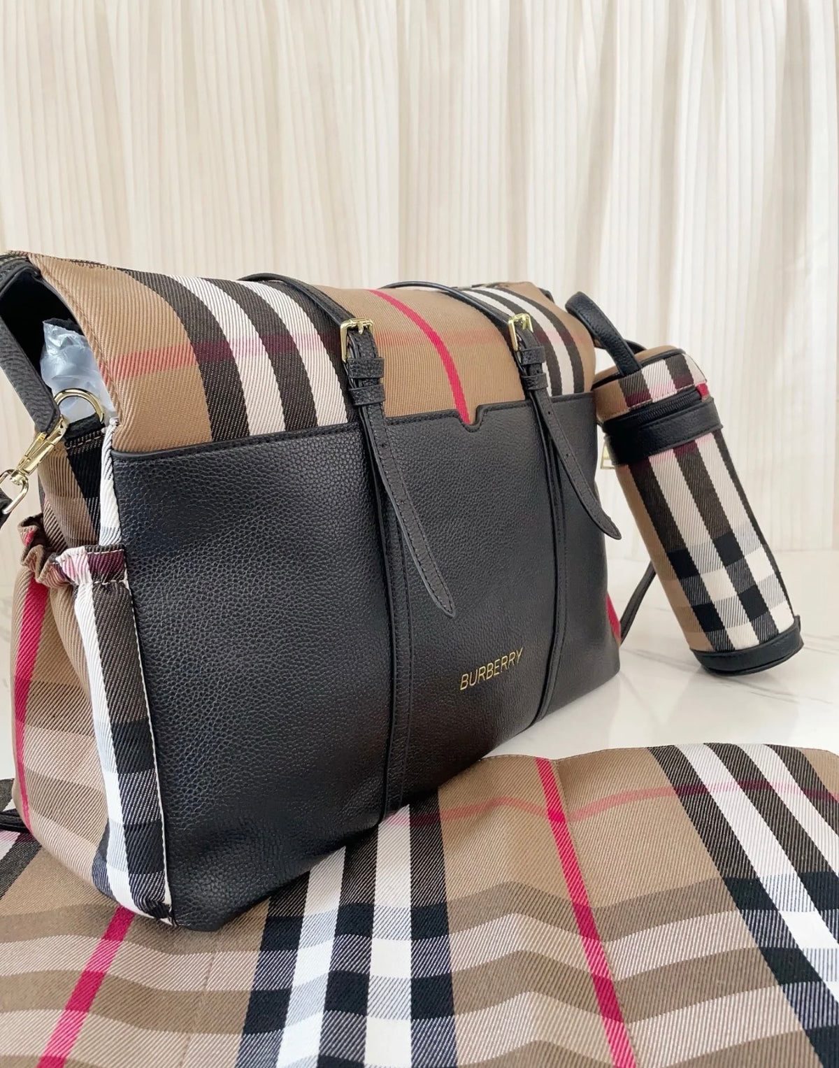 Black and chequered changing bag