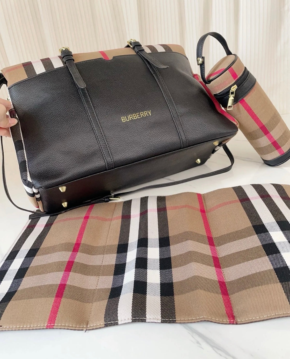 Black and chequered changing bag
