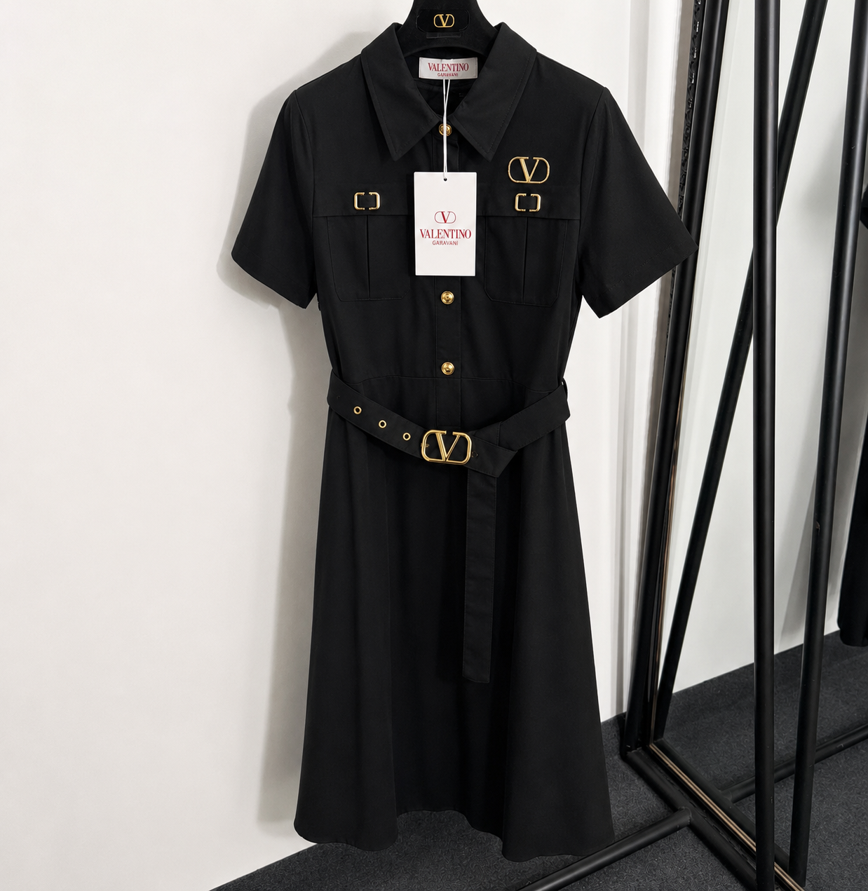 Black dress with gold v